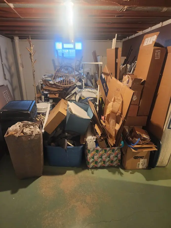 Roll-off dumpster container at job site for 2 Yard Dumpster Rental in Bedford